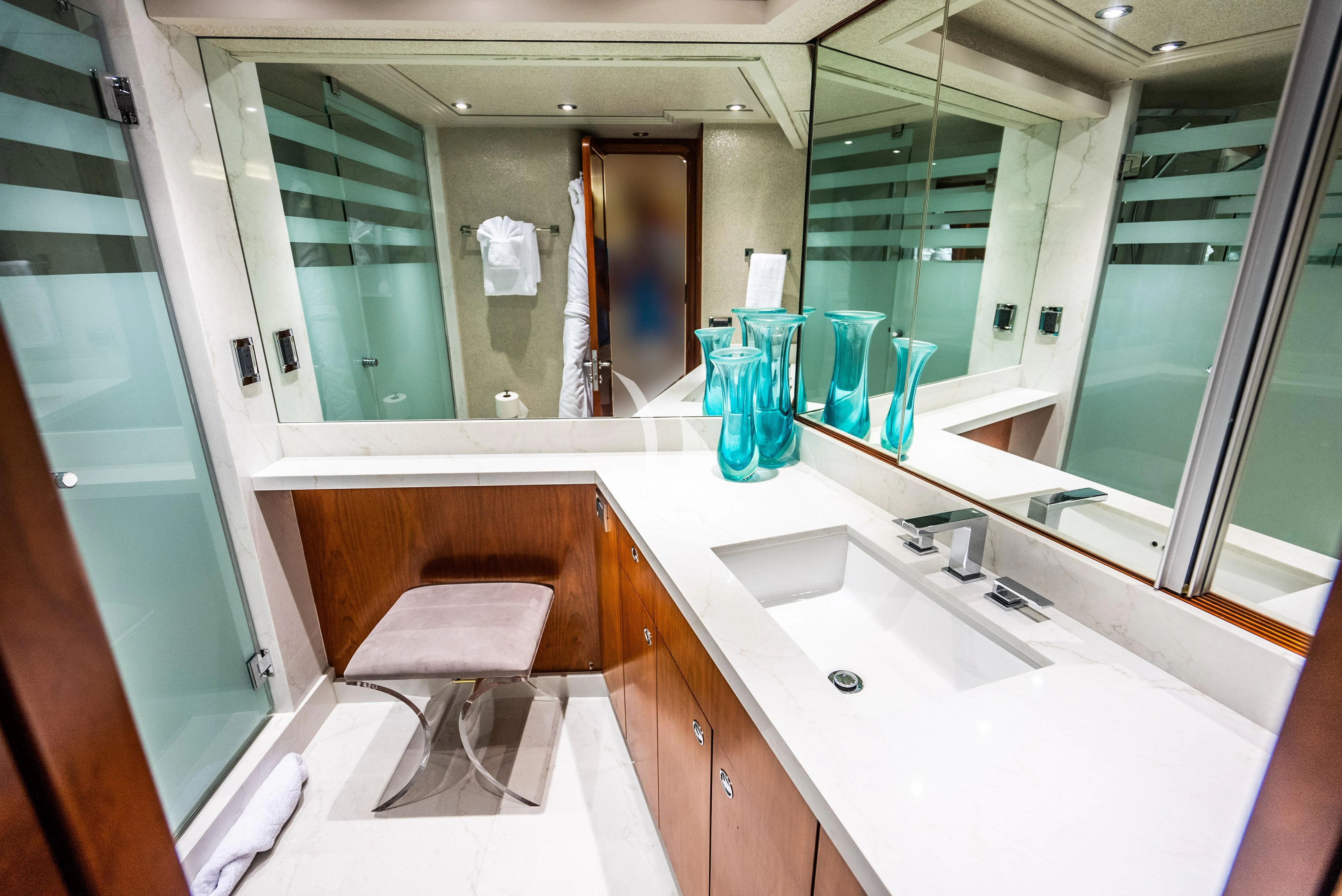 a bathroom with a large mirror aboard KEMOSABE Yacht for Charter