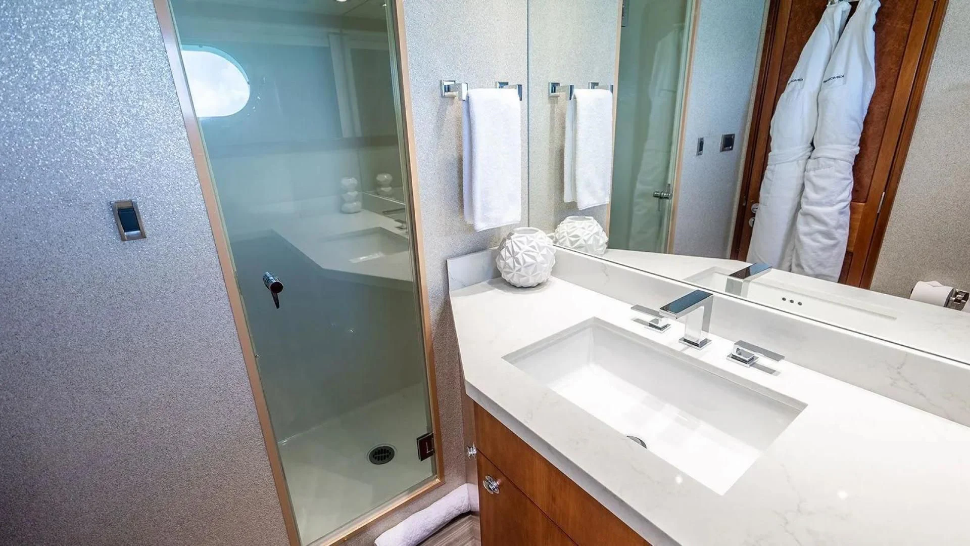 a bathroom with a large mirror aboard KEMOSABE Yacht for Charter