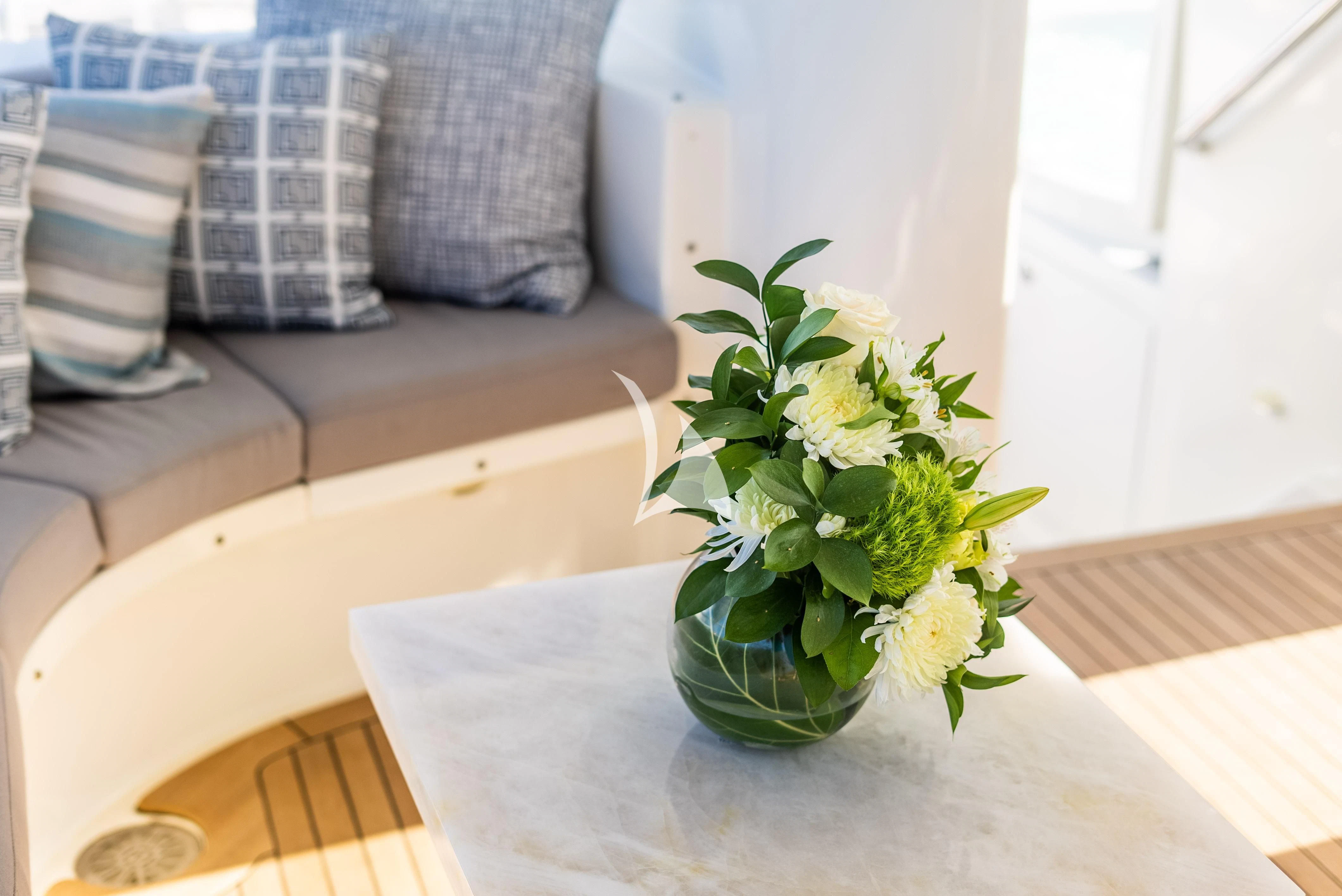 a plant in a pot on a table aboard KEMOSABE Yacht for Charter