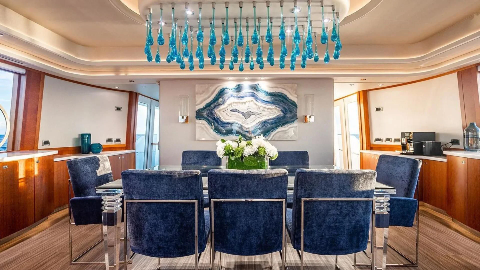a room with chairs and tables aboard KEMOSABE Yacht for Charter
