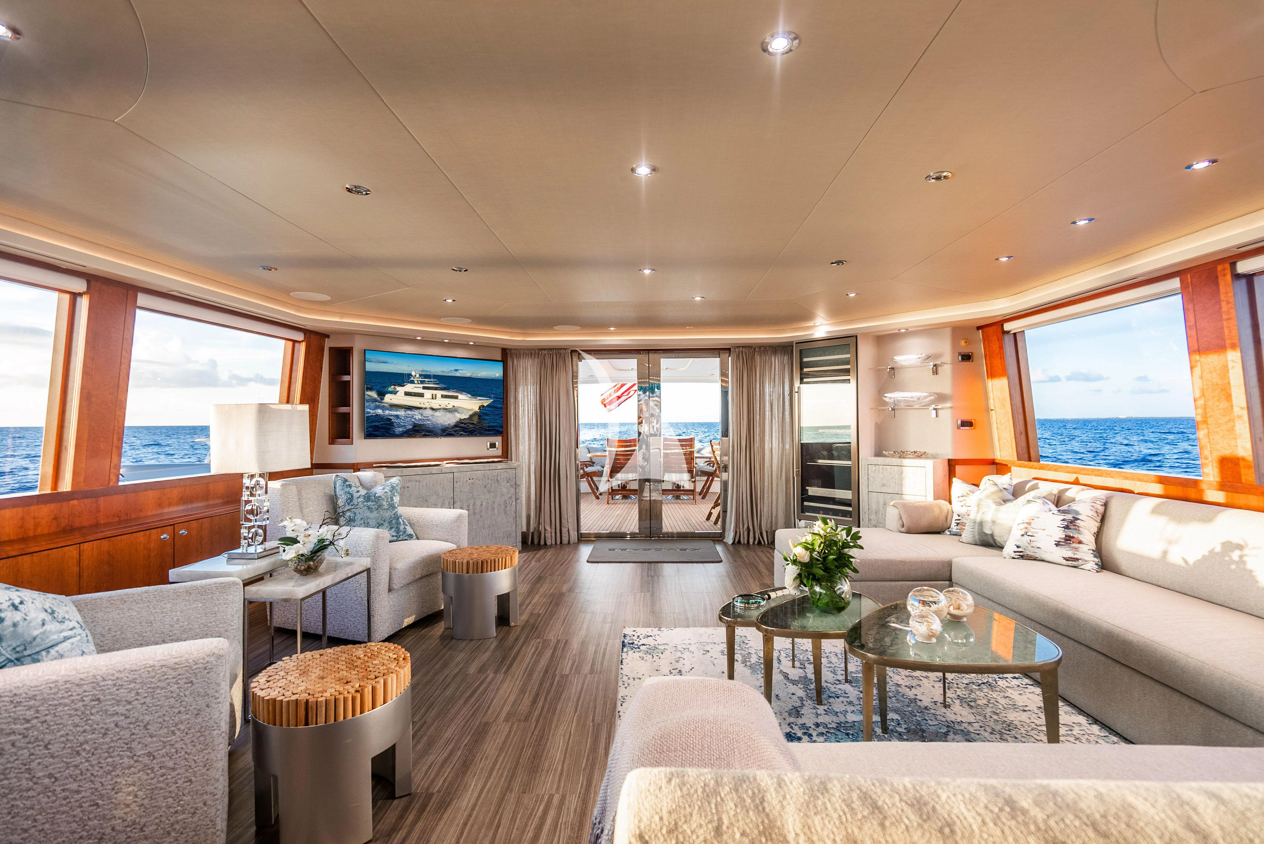 a living room with a large screen aboard KEMOSABE Yacht for Charter