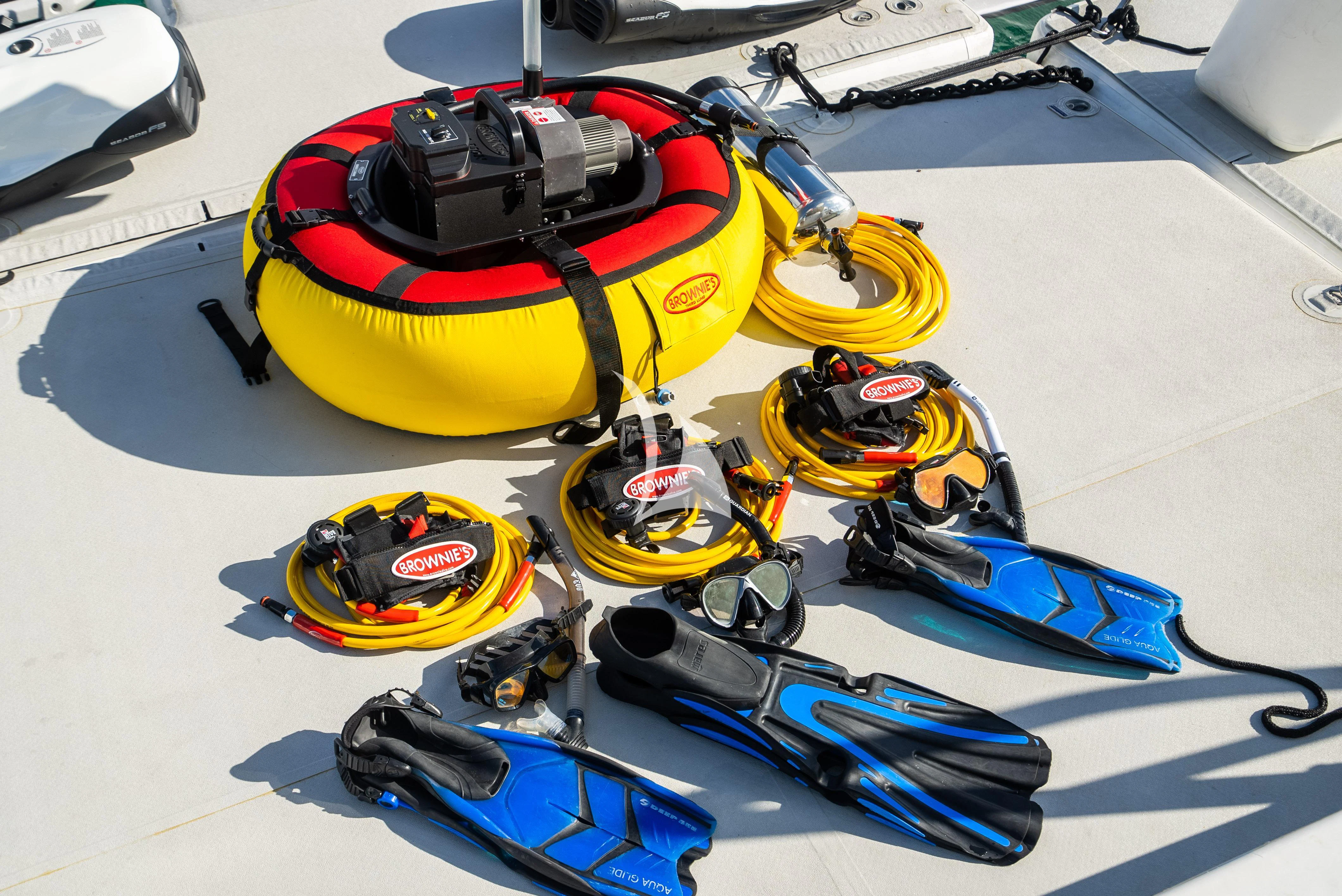 a yellow and black helmet on a white surface aboard KEMOSABE Yacht for Charter