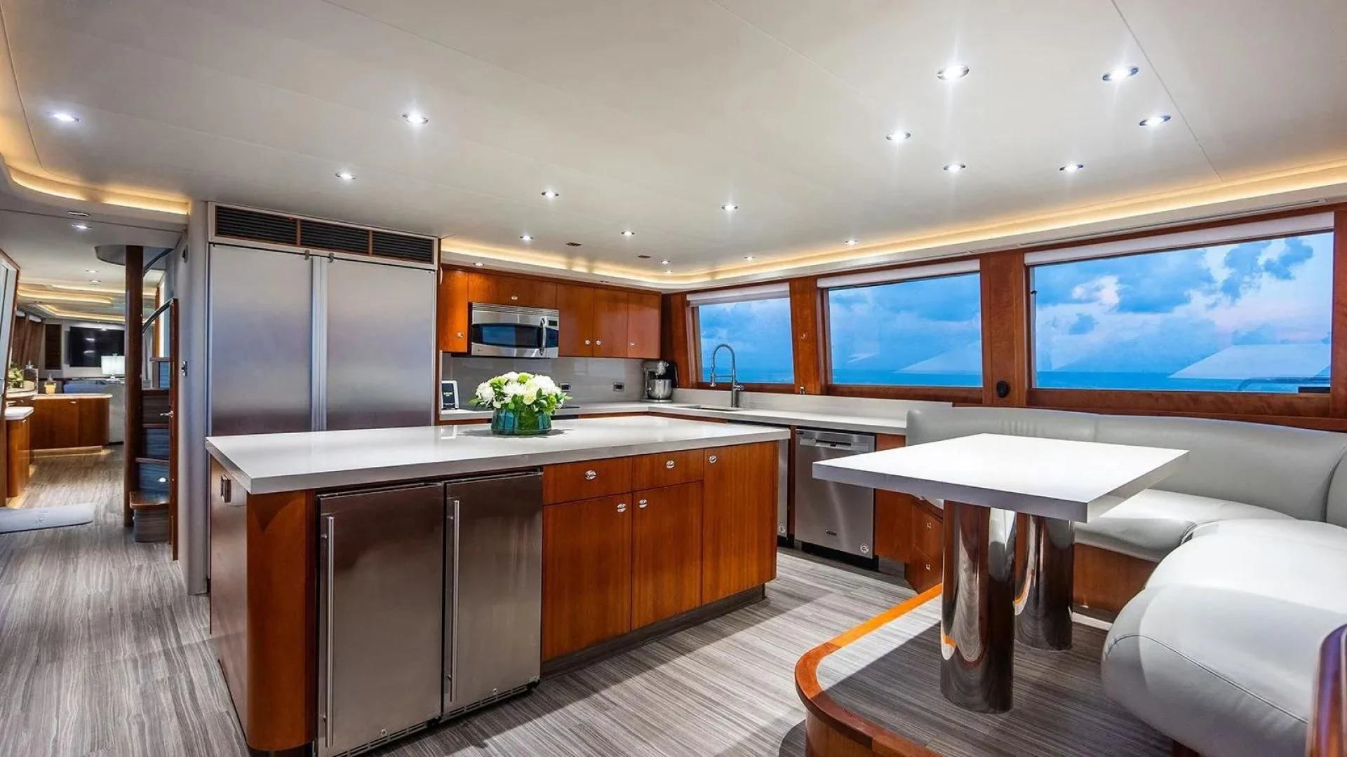 a large kitchen with a large island aboard KEMOSABE Yacht for Charter