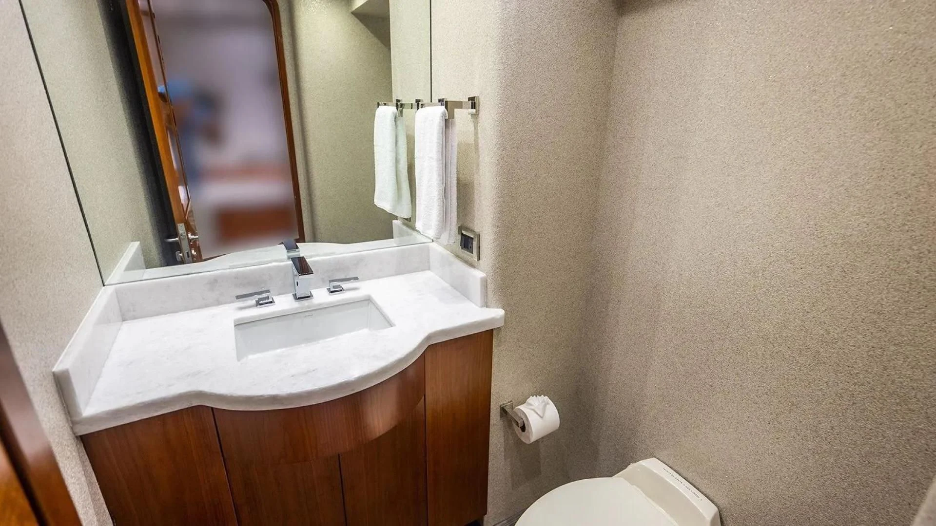 a bathroom with a large mirror aboard KEMOSABE Yacht for Charter