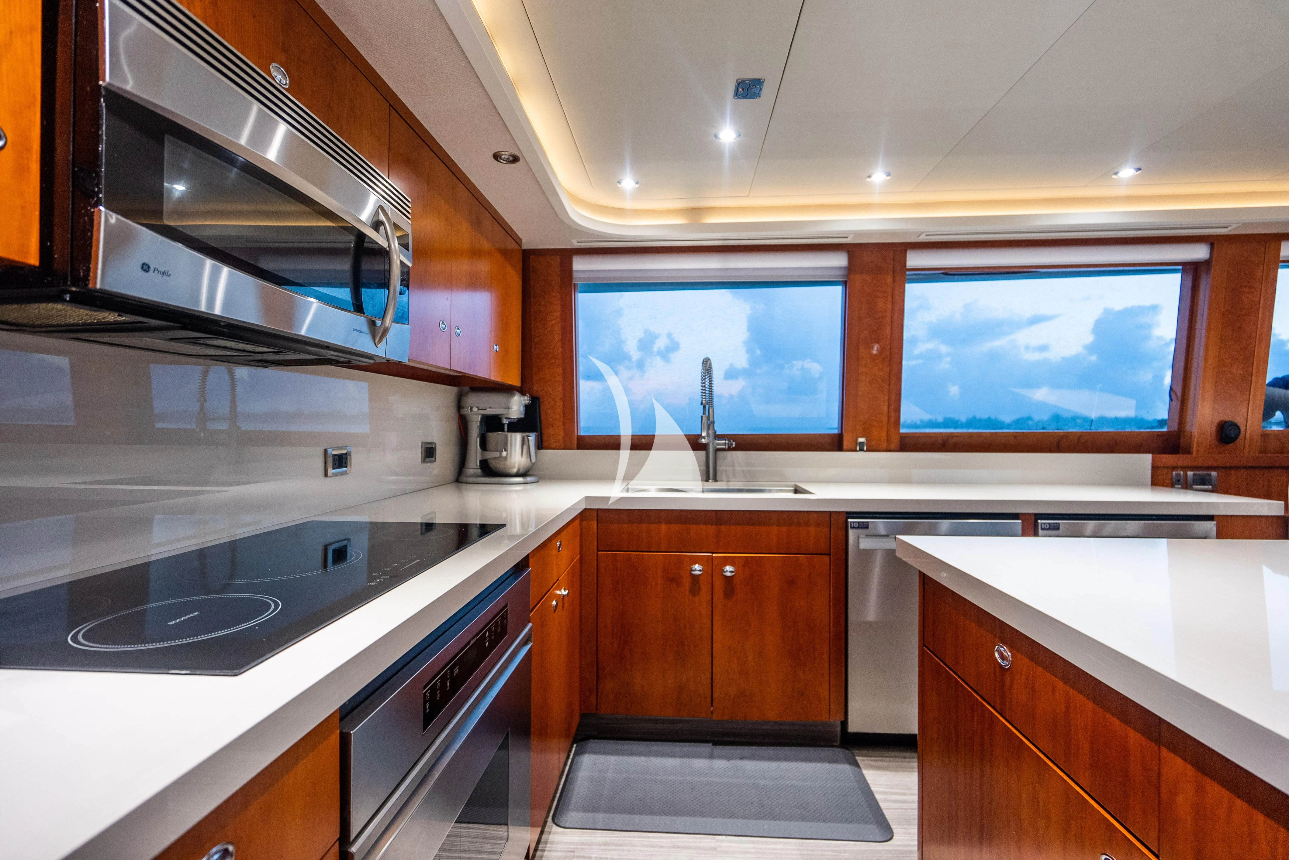 a kitchen with a stove and oven aboard KEMOSABE Yacht for Charter