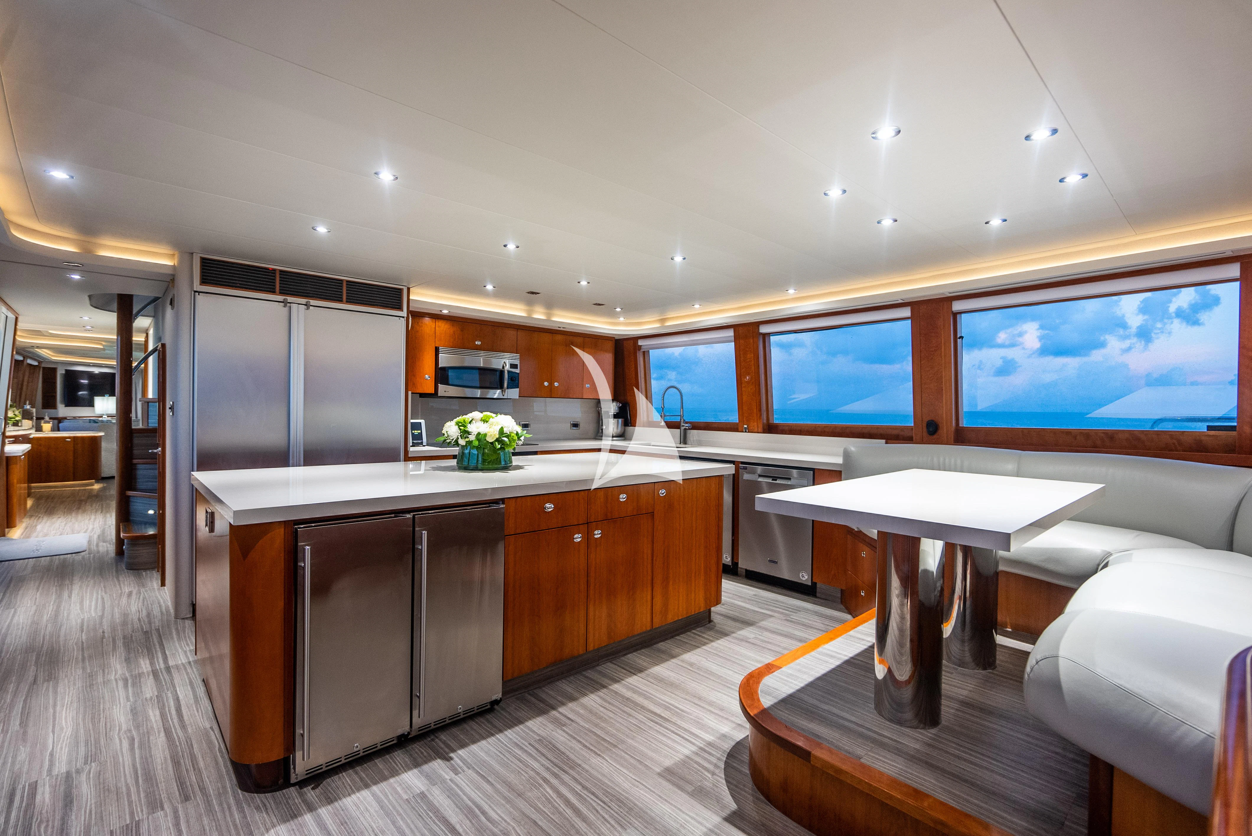 a large kitchen with a large island aboard KEMOSABE Yacht for Charter