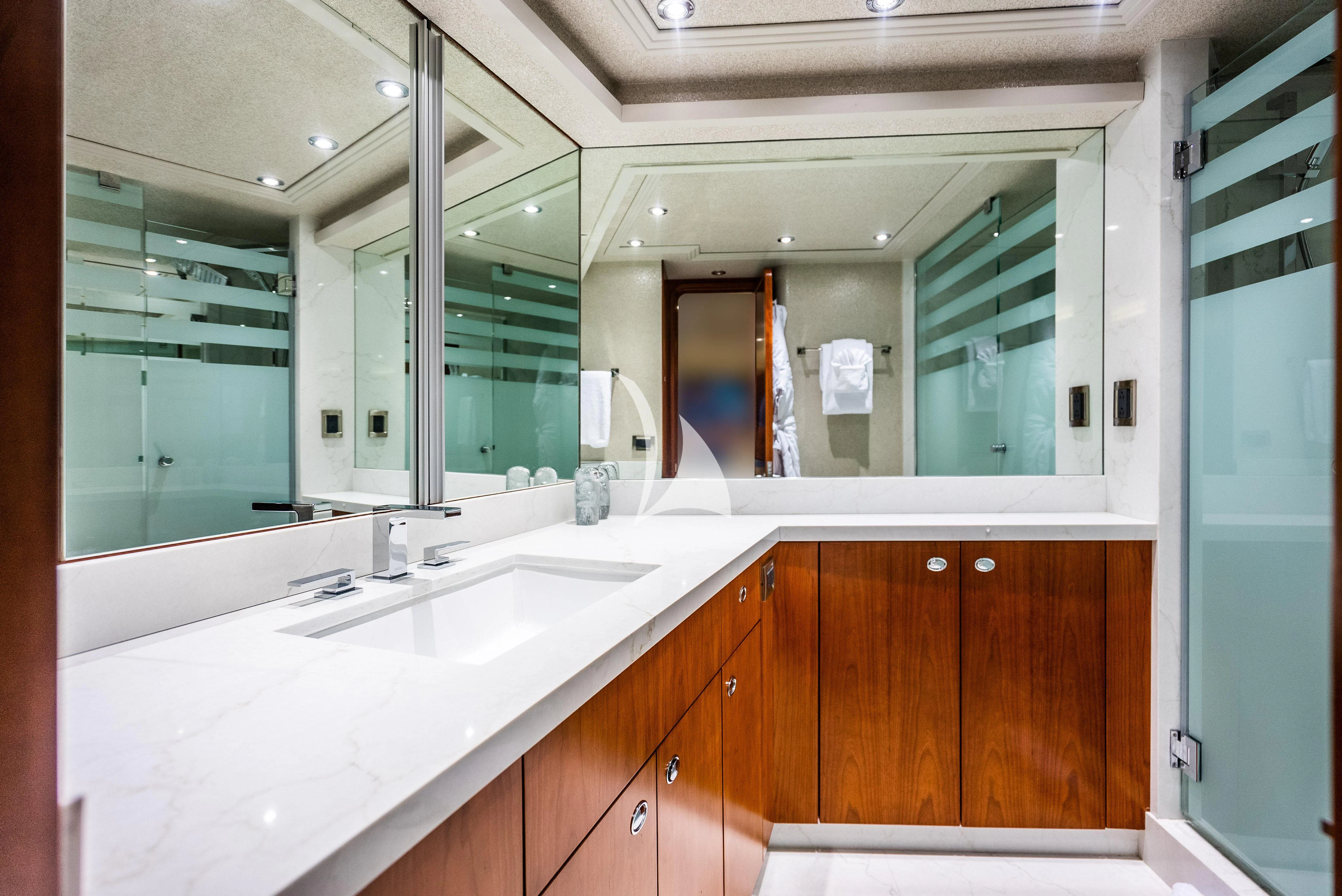 a bathroom with a large mirror aboard KEMOSABE Yacht for Charter