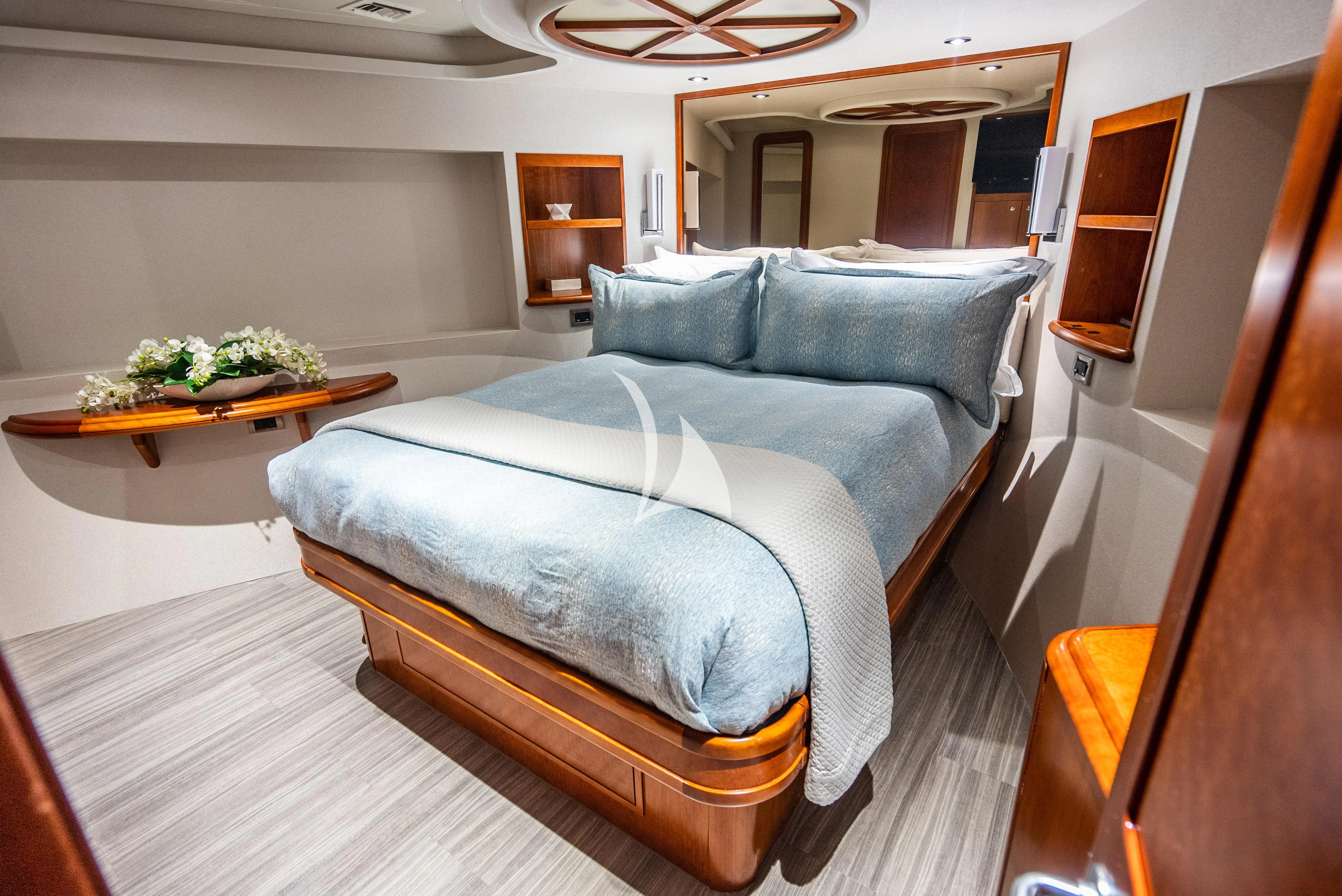 a bed in a room aboard KEMOSABE Yacht for Charter