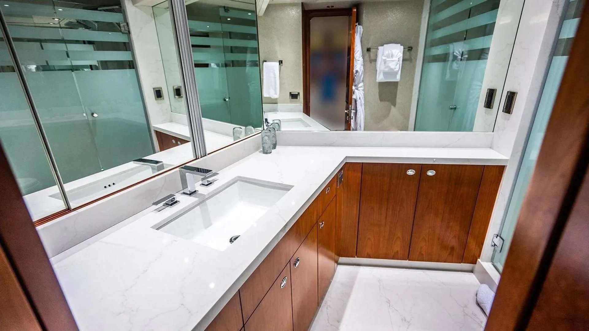 a bathroom with a large mirror aboard KEMOSABE Yacht for Charter