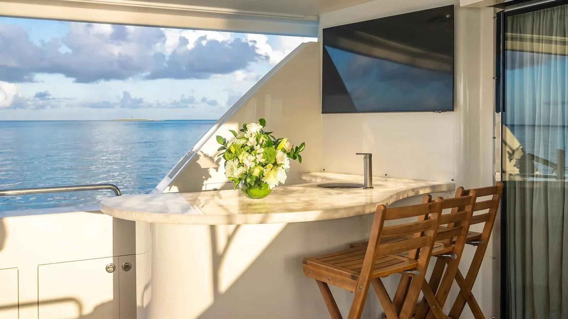 a table with a plant on it aboard KEMOSABE Yacht for Charter