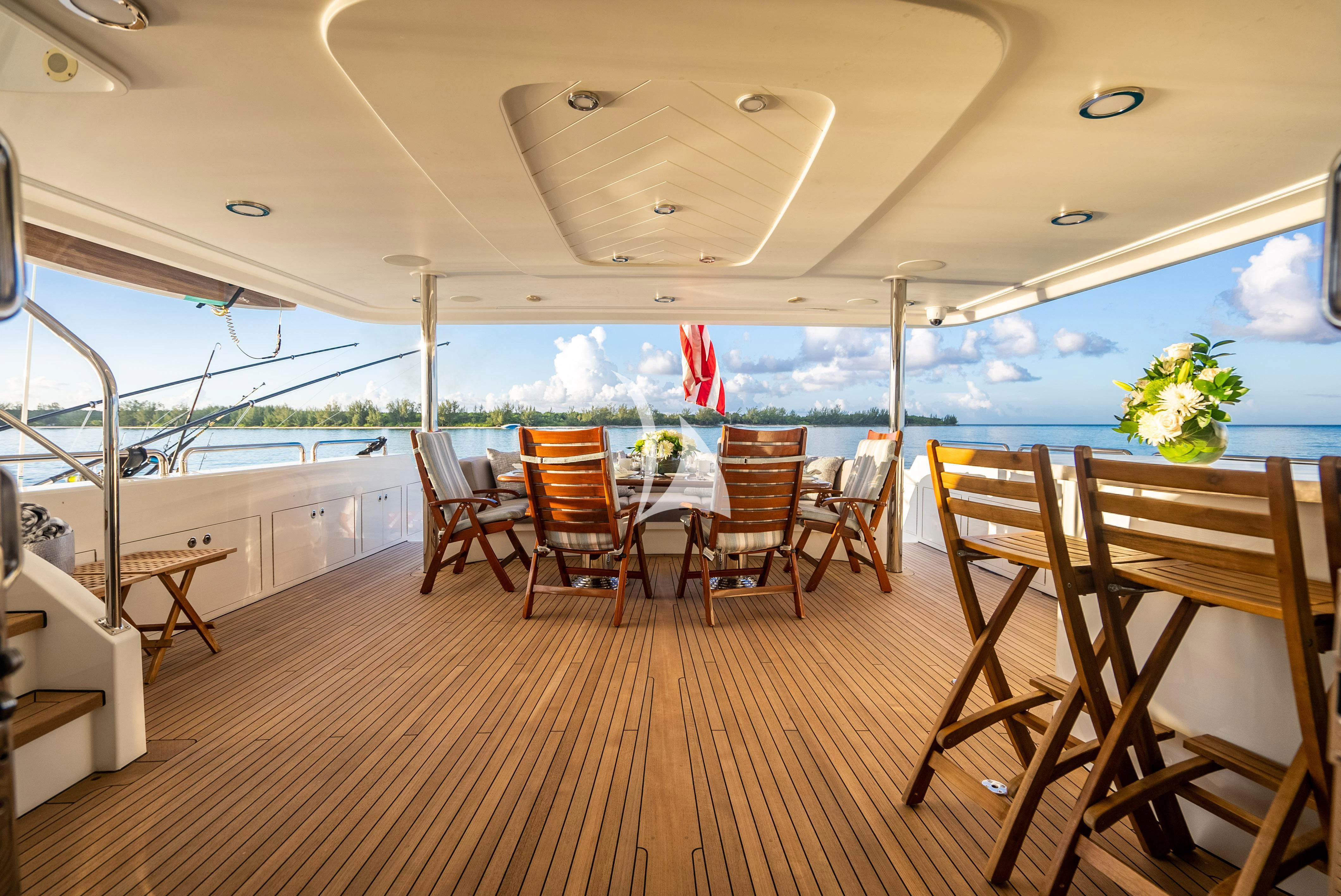 a boat with tables and chairs aboard KEMOSABE Yacht for Charter