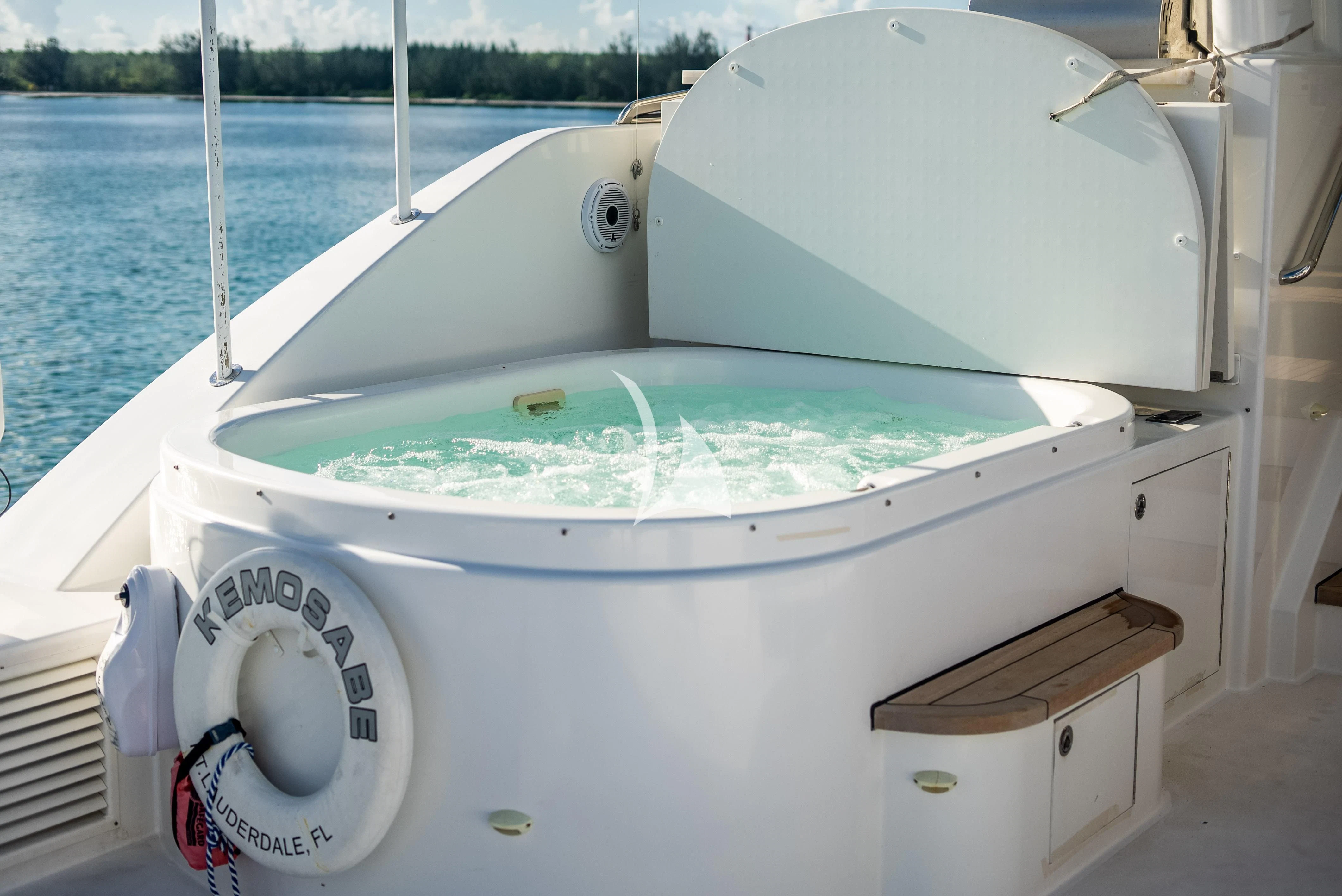 a boat with a large amount of water in the background aboard KEMOSABE Yacht for Charter
