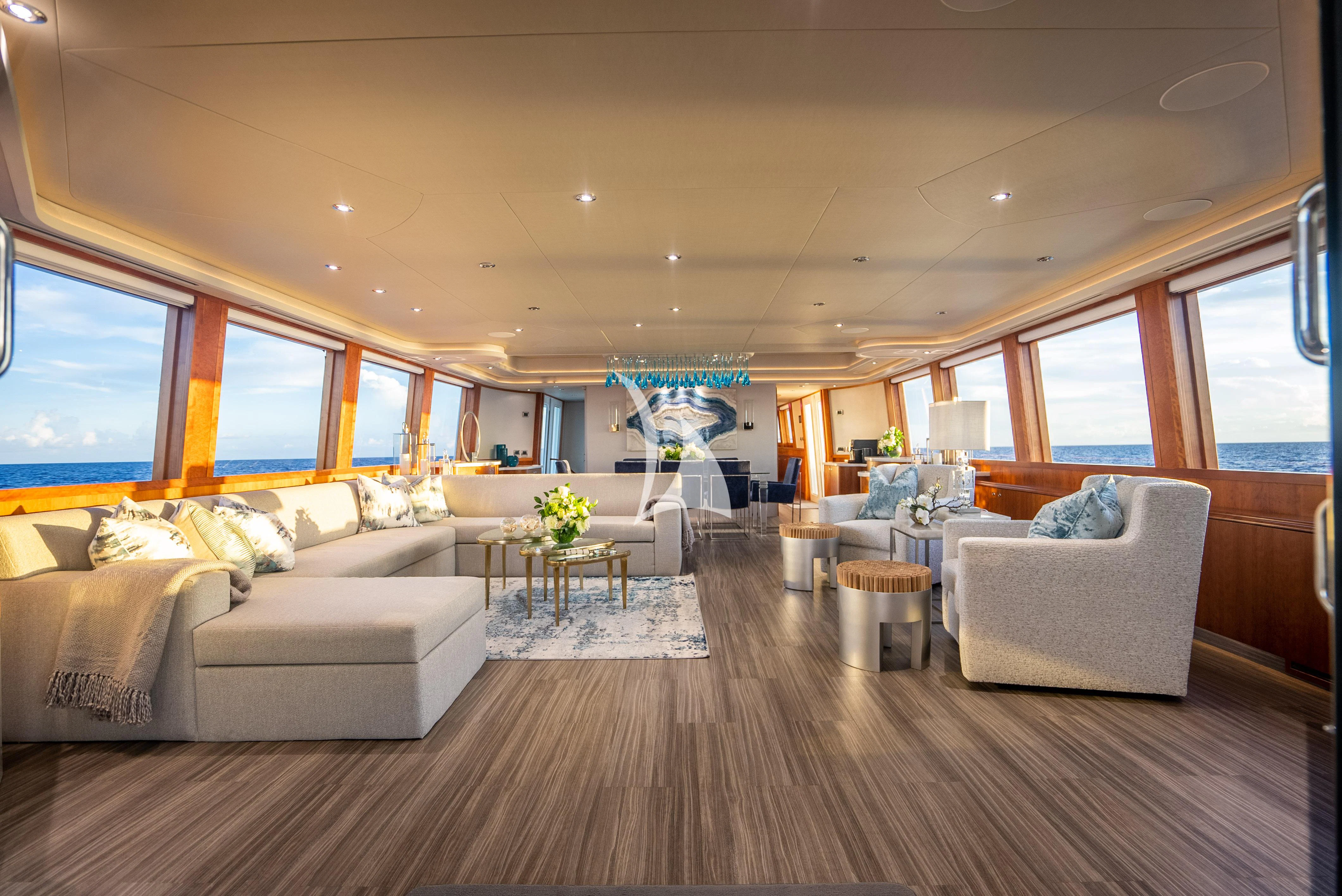 a living room with a large window aboard KEMOSABE Yacht for Charter
