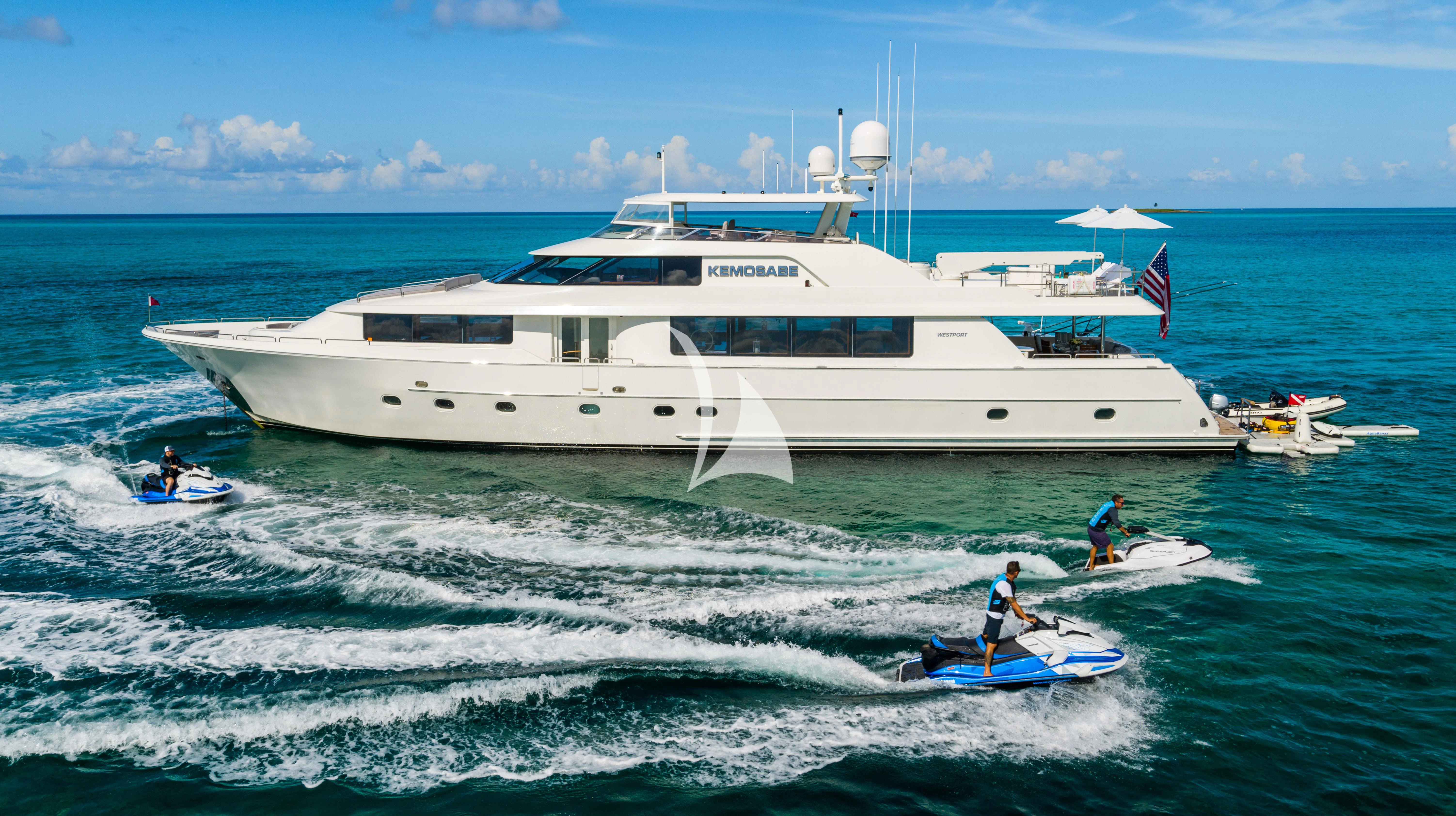 a boat in the water with people in it aboard KEMOSABE Yacht for Charter