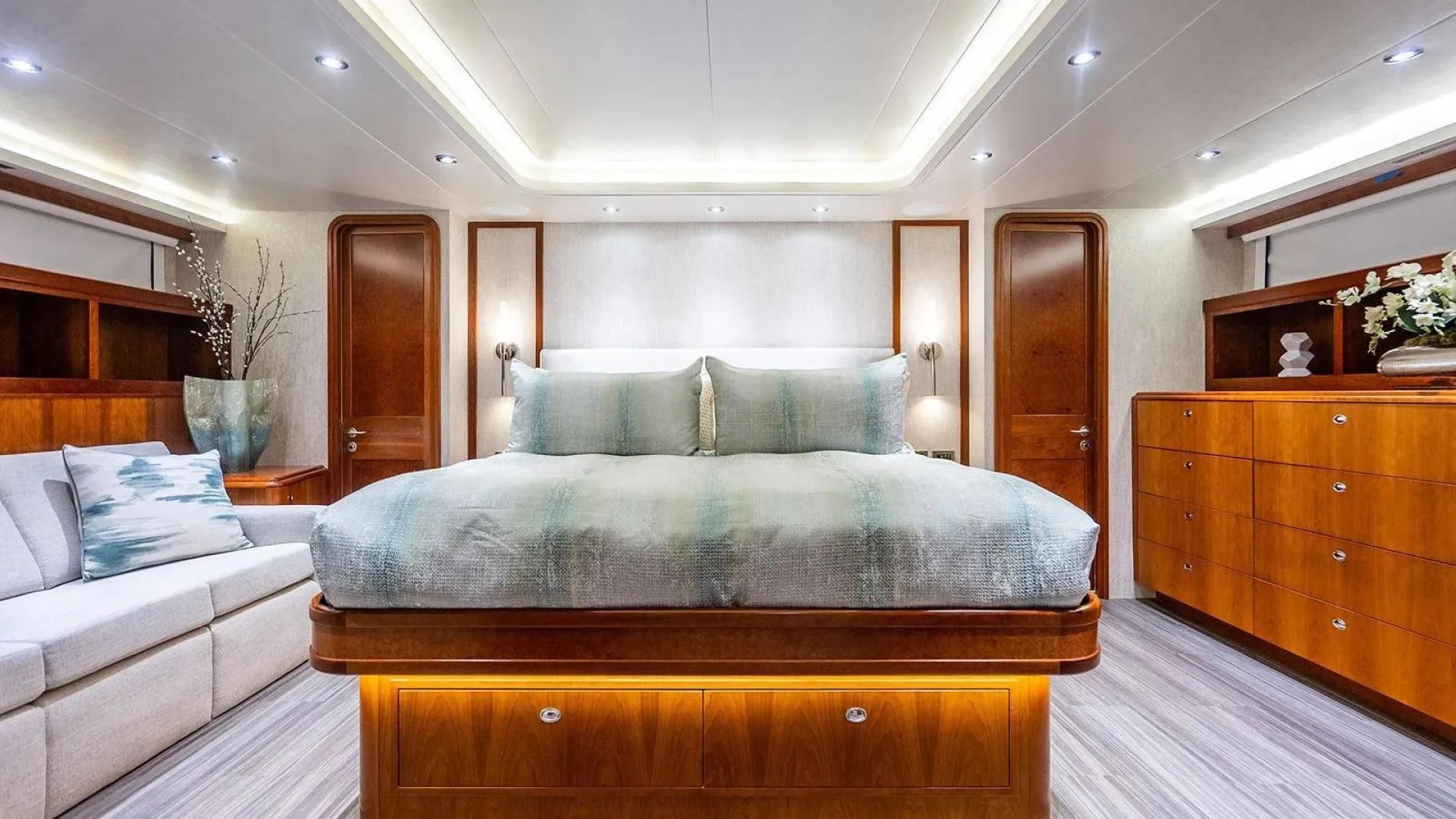 a large bedroom with a bed aboard KEMOSABE Yacht for Charter