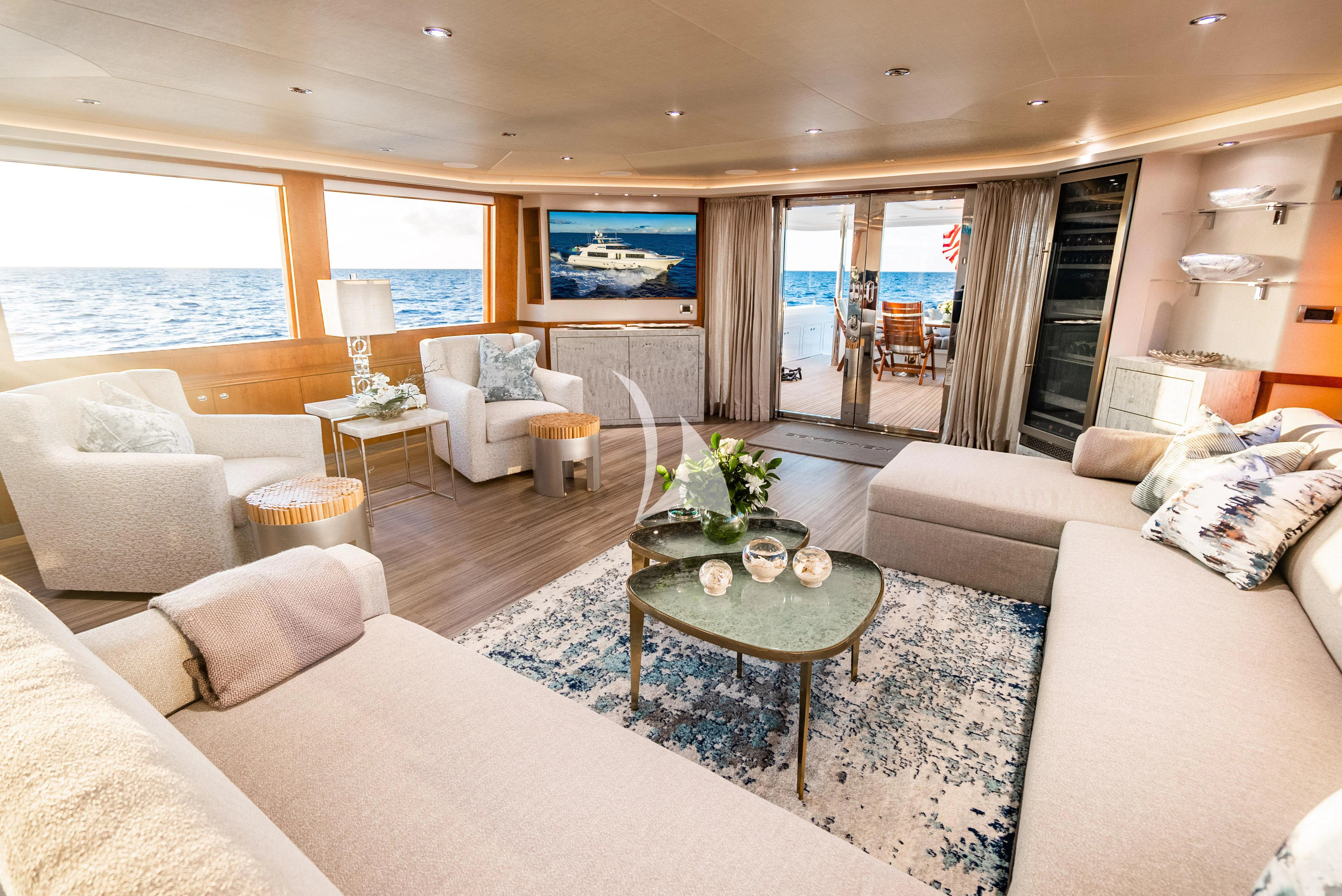 a living room with a large window aboard KEMOSABE Yacht for Charter