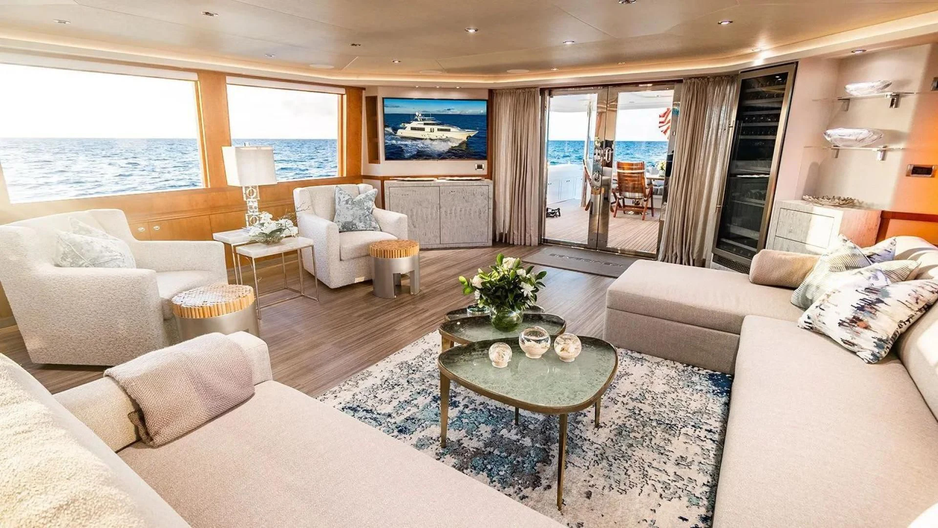 a living room with a large window aboard KEMOSABE Yacht for Charter