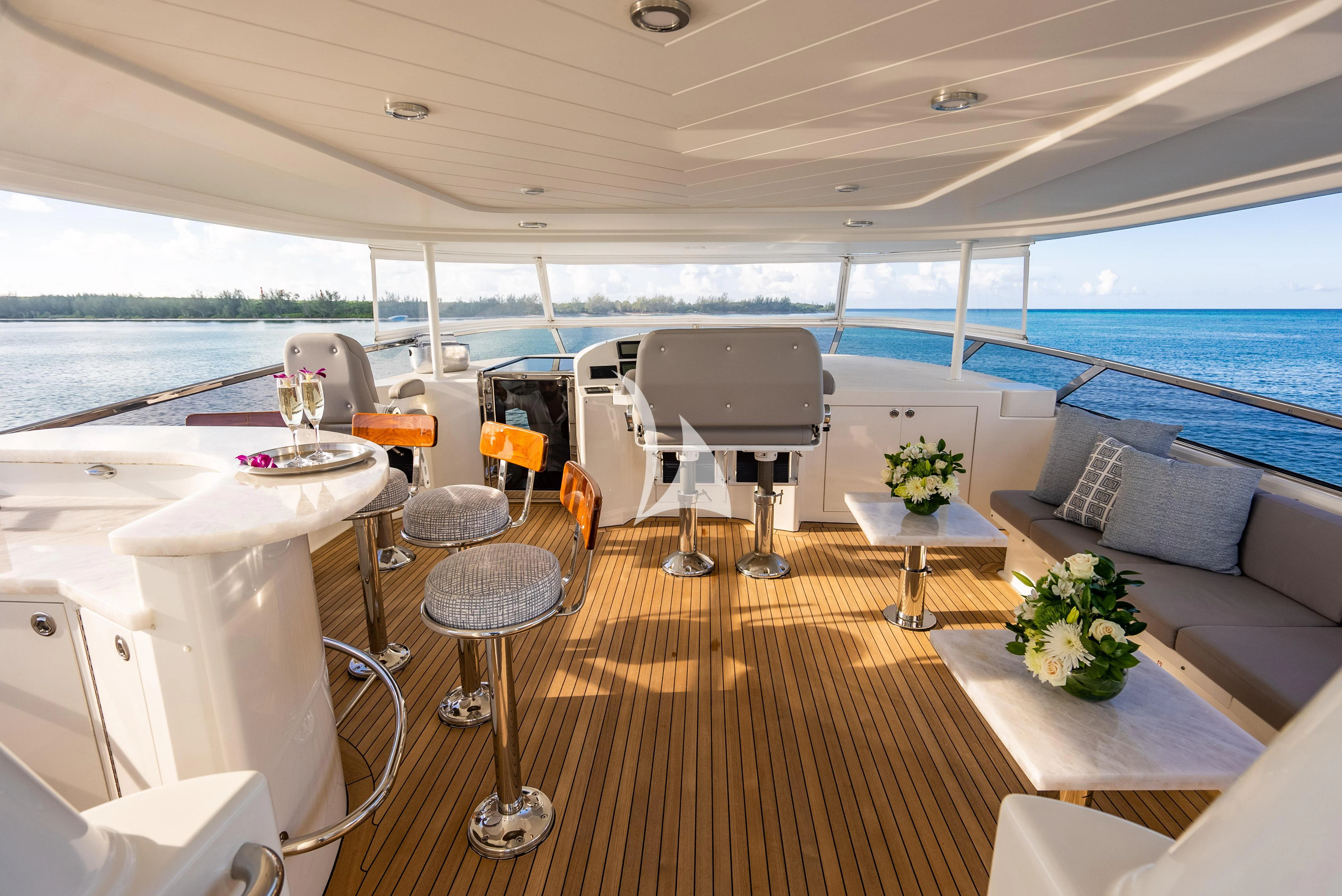 a room with a couch and a table and chairs aboard KEMOSABE Yacht for Charter