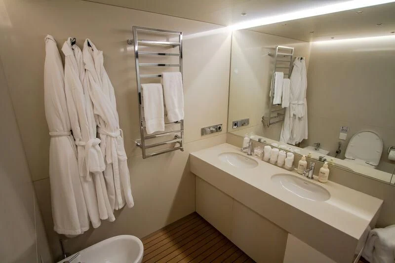 a bathroom with a large mirror aboard OCEAN SAPPHIRE Yacht for Sale