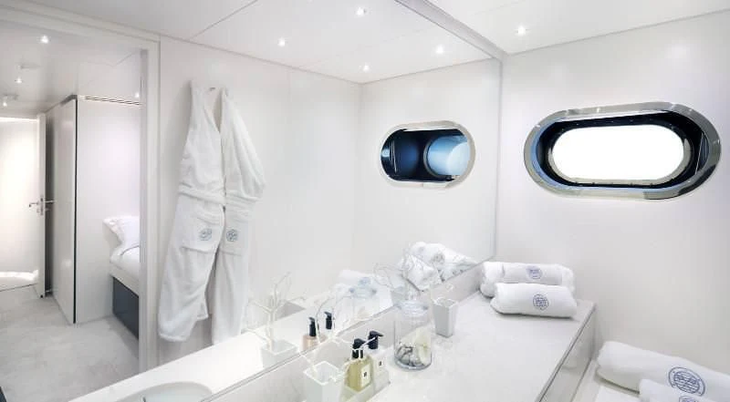 a bathroom with a large mirror aboard OCEAN SAPPHIRE Yacht for Sale