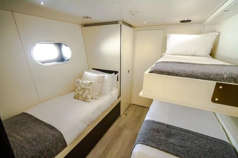 a room with two beds aboard OCEAN SAPPHIRE Yacht for Sale