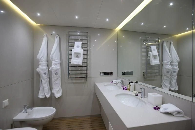 a bathroom with a large mirror aboard OCEAN SAPPHIRE Yacht for Sale