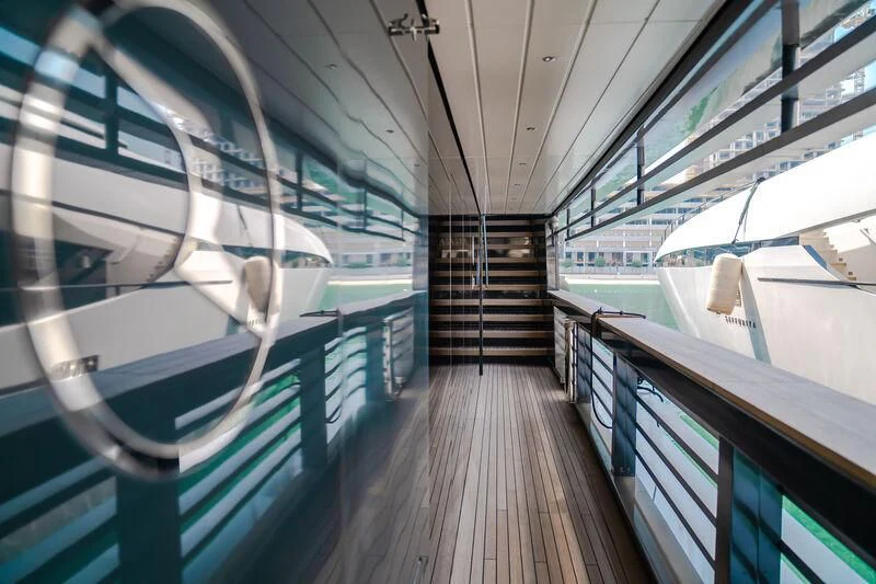 a walkway with metal railings aboard OCEAN SAPPHIRE Yacht for Sale
