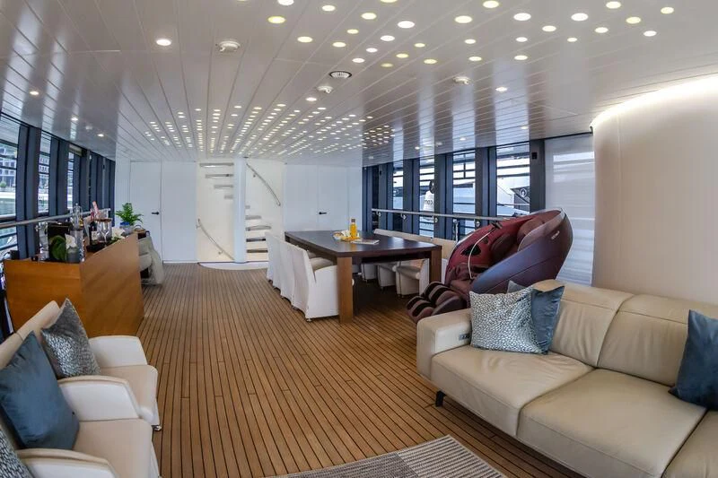 a living room with a large window aboard OCEAN SAPPHIRE Yacht for Sale