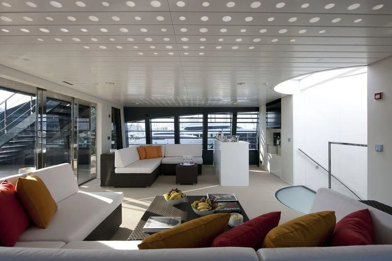 a living room with a large window aboard OCEAN SAPPHIRE Yacht for Sale