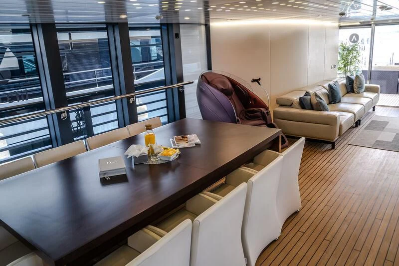 a room with a couch and a table aboard OCEAN SAPPHIRE Yacht for Sale