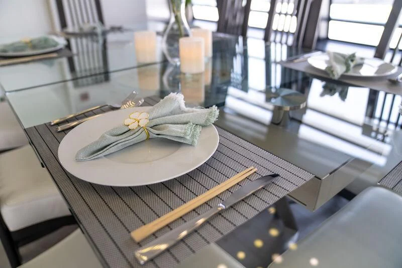 a table with a plate and fork aboard OCEAN SAPPHIRE Yacht for Sale