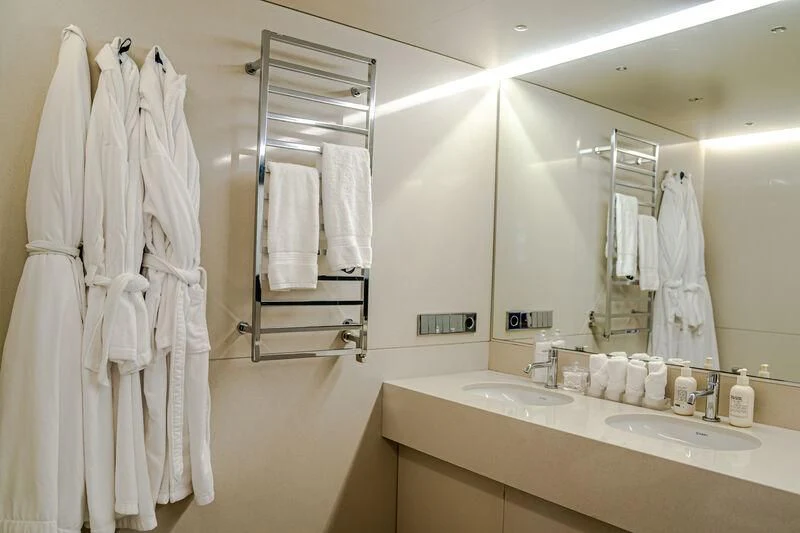 a bathroom with a large mirror aboard OCEAN SAPPHIRE Yacht for Sale