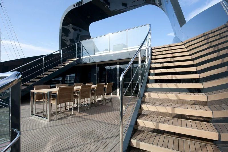 a large wooden staircase with a railing aboard OCEAN SAPPHIRE Yacht for Sale