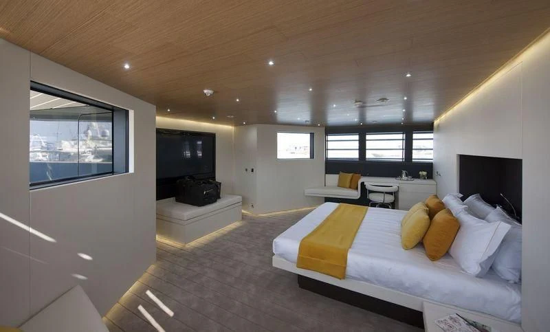 a bedroom with a bed and a tv aboard OCEAN SAPPHIRE Yacht for Sale