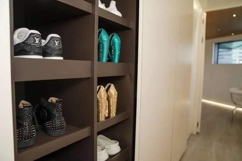 a shelf with shoes and shoes aboard OCEAN SAPPHIRE Yacht for Sale