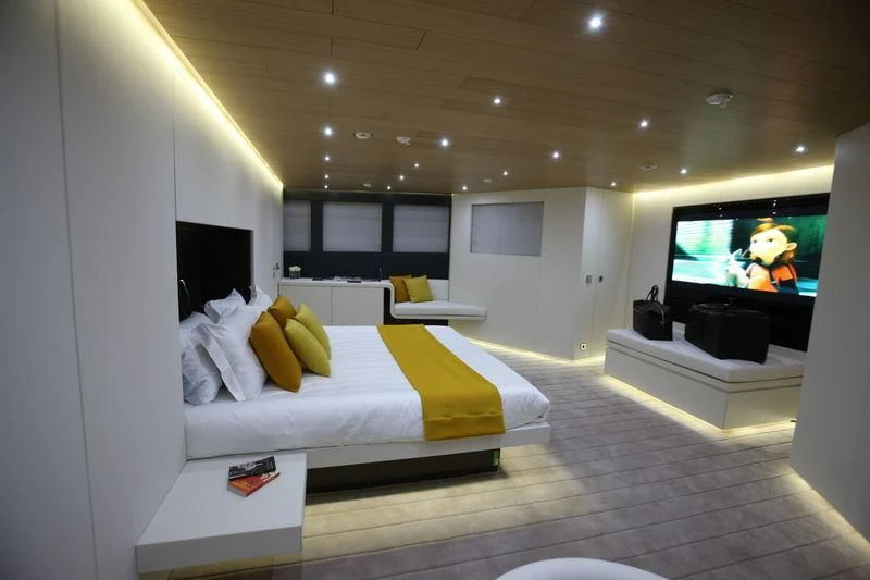 a bedroom with a tv and a bed aboard OCEAN SAPPHIRE Yacht for Sale