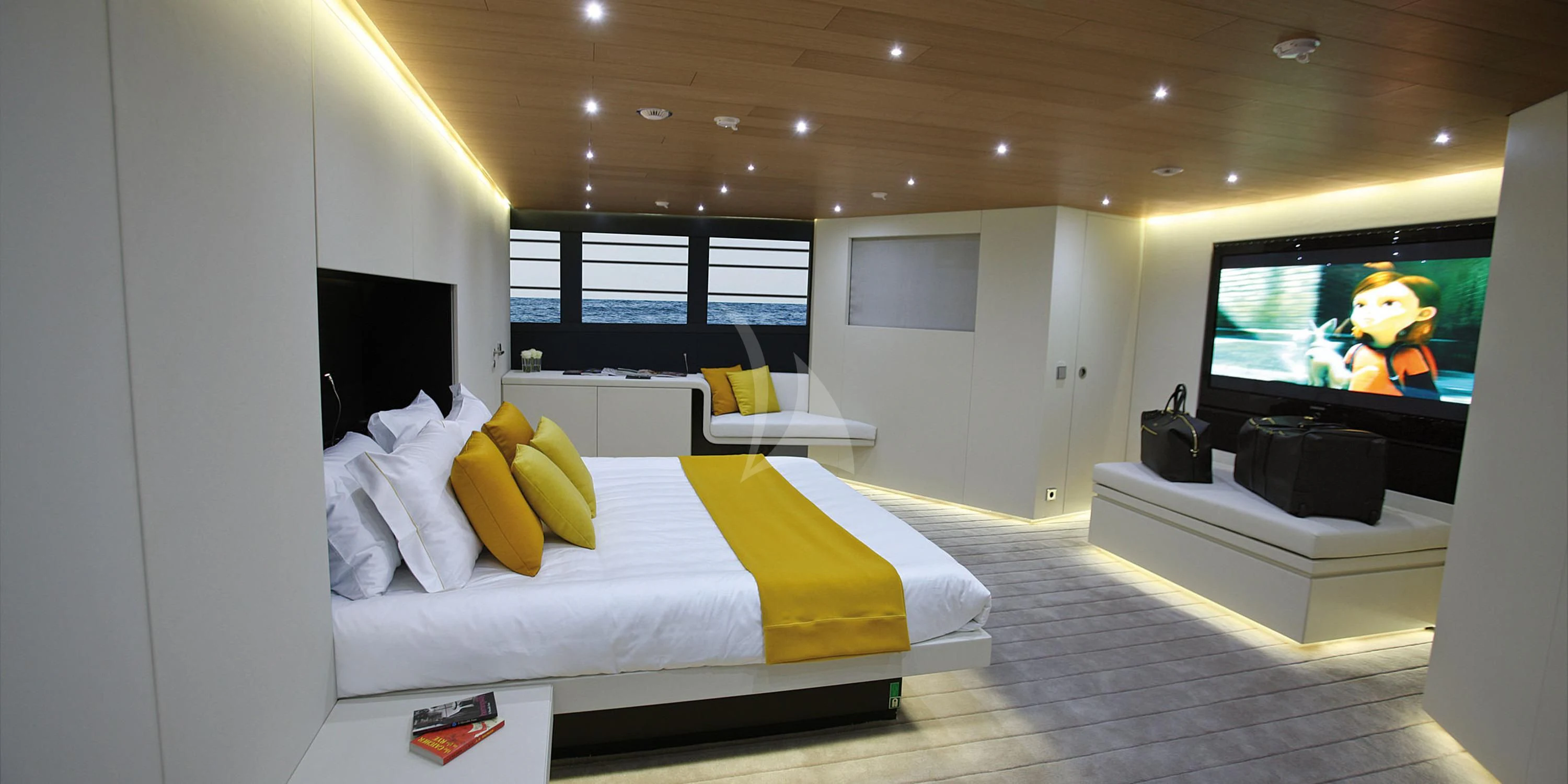 a room with a bed and a tv aboard OCEAN SAPPHIRE Yacht for Sale