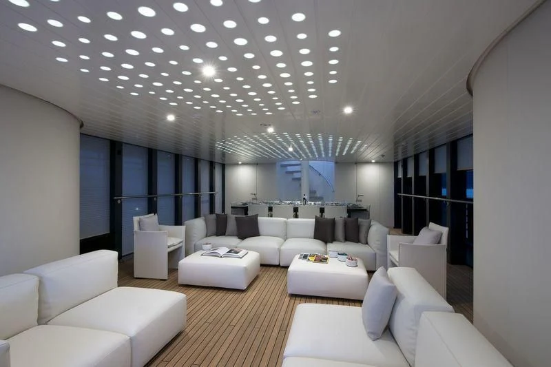 a large room with white couches aboard OCEAN SAPPHIRE Yacht for Sale