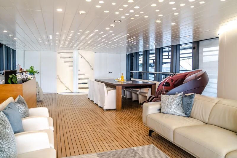 a living room with a couch and a table aboard OCEAN SAPPHIRE Yacht for Sale