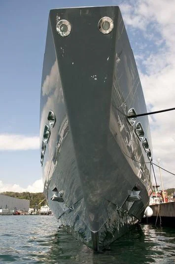 a large grey ship in the water aboard OCEAN SAPPHIRE Yacht for Sale