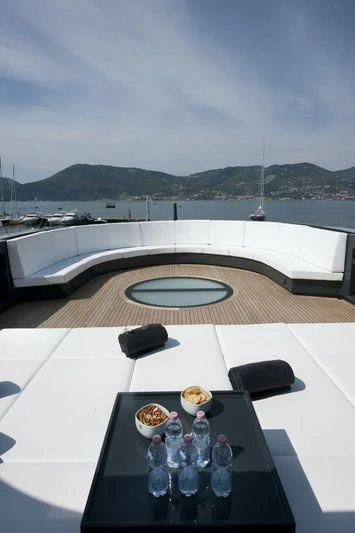 a table with a plate of food on it aboard OCEAN SAPPHIRE Yacht for Sale