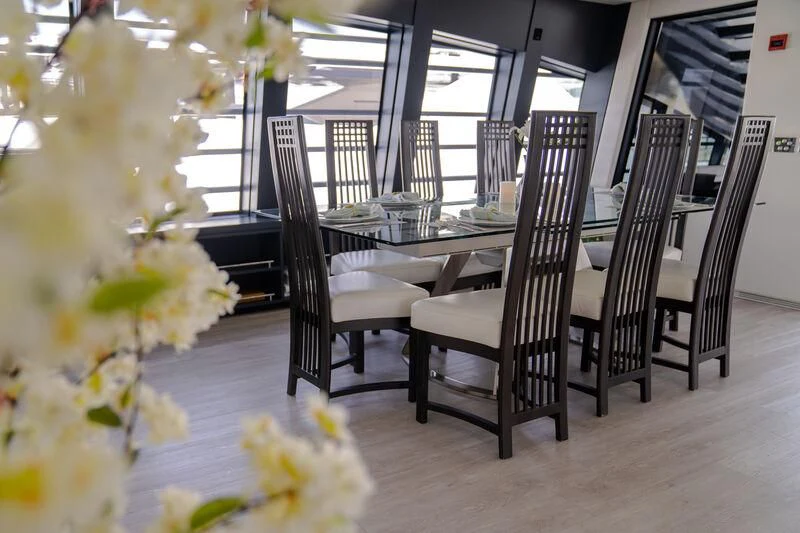 a group of chairs on a porch aboard OCEAN SAPPHIRE Yacht for Sale