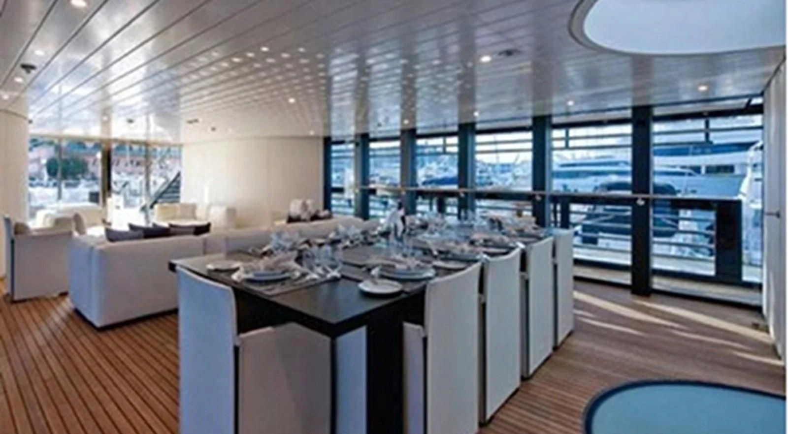 a large dining room with a large window aboard OCEAN SAPPHIRE Yacht for Sale