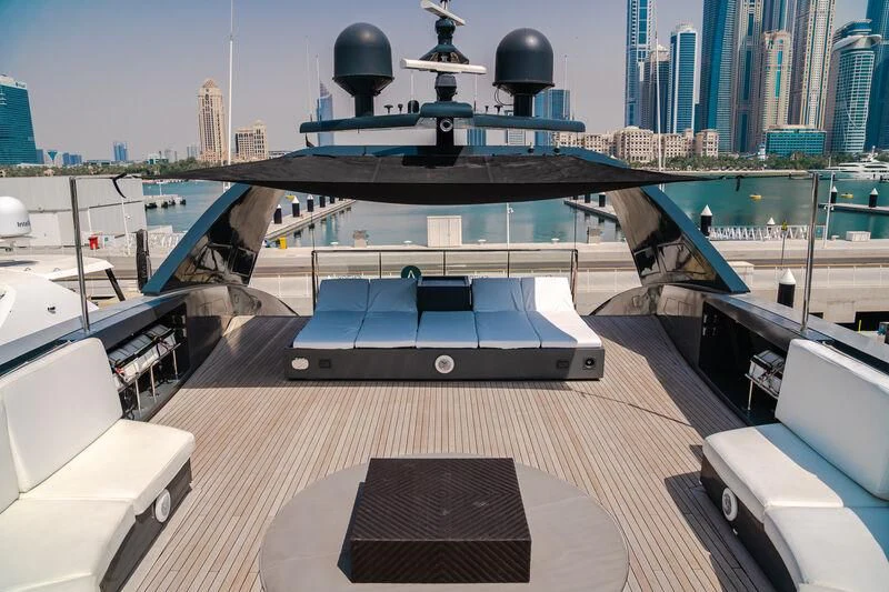 a deck with a large pool and a city skyline aboard OCEAN SAPPHIRE Yacht for Sale