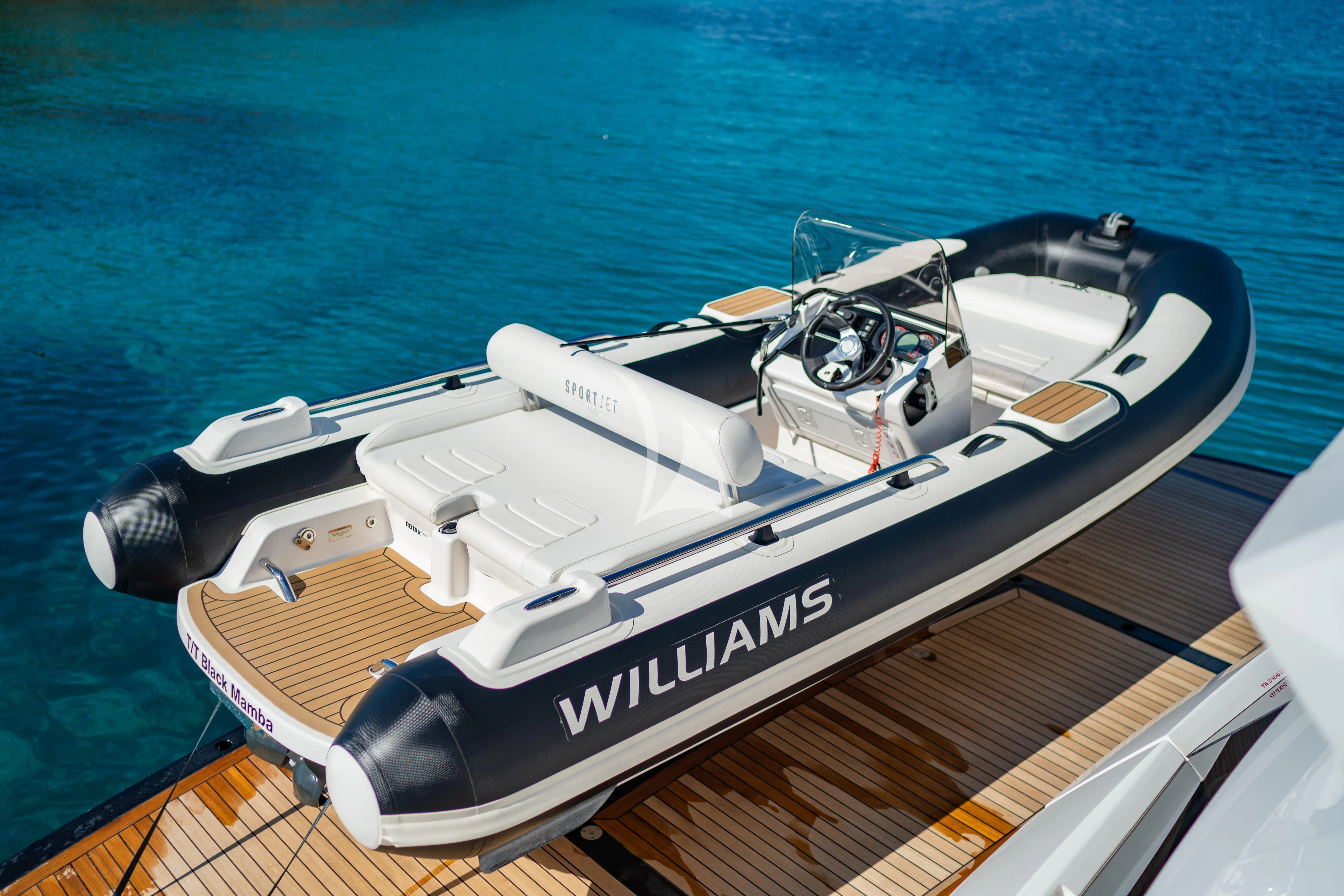 a boat on the water aboard BLACK MAMBA Yacht for Charter