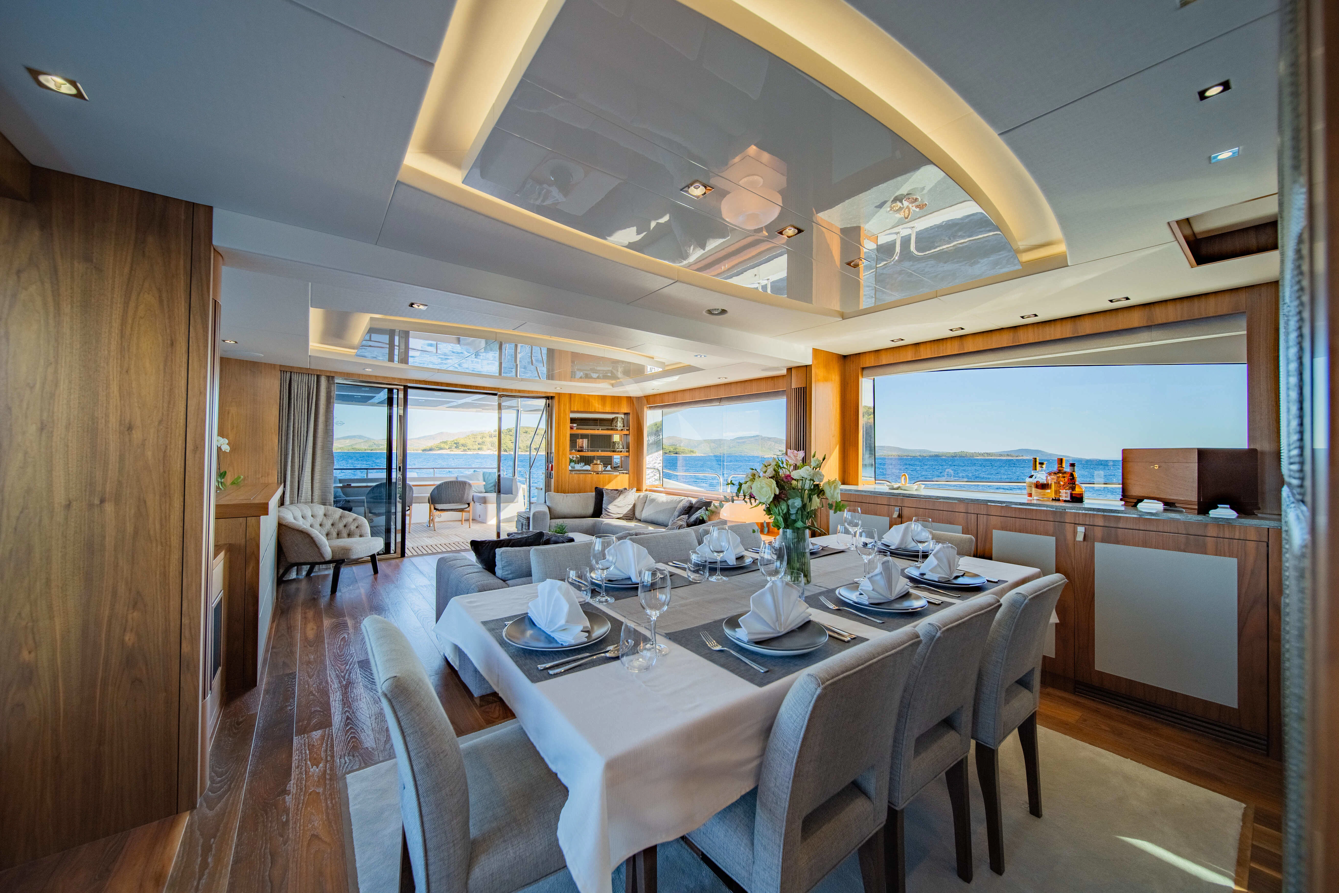 a large dining table in a kitchen aboard BLACK MAMBA Yacht for Charter