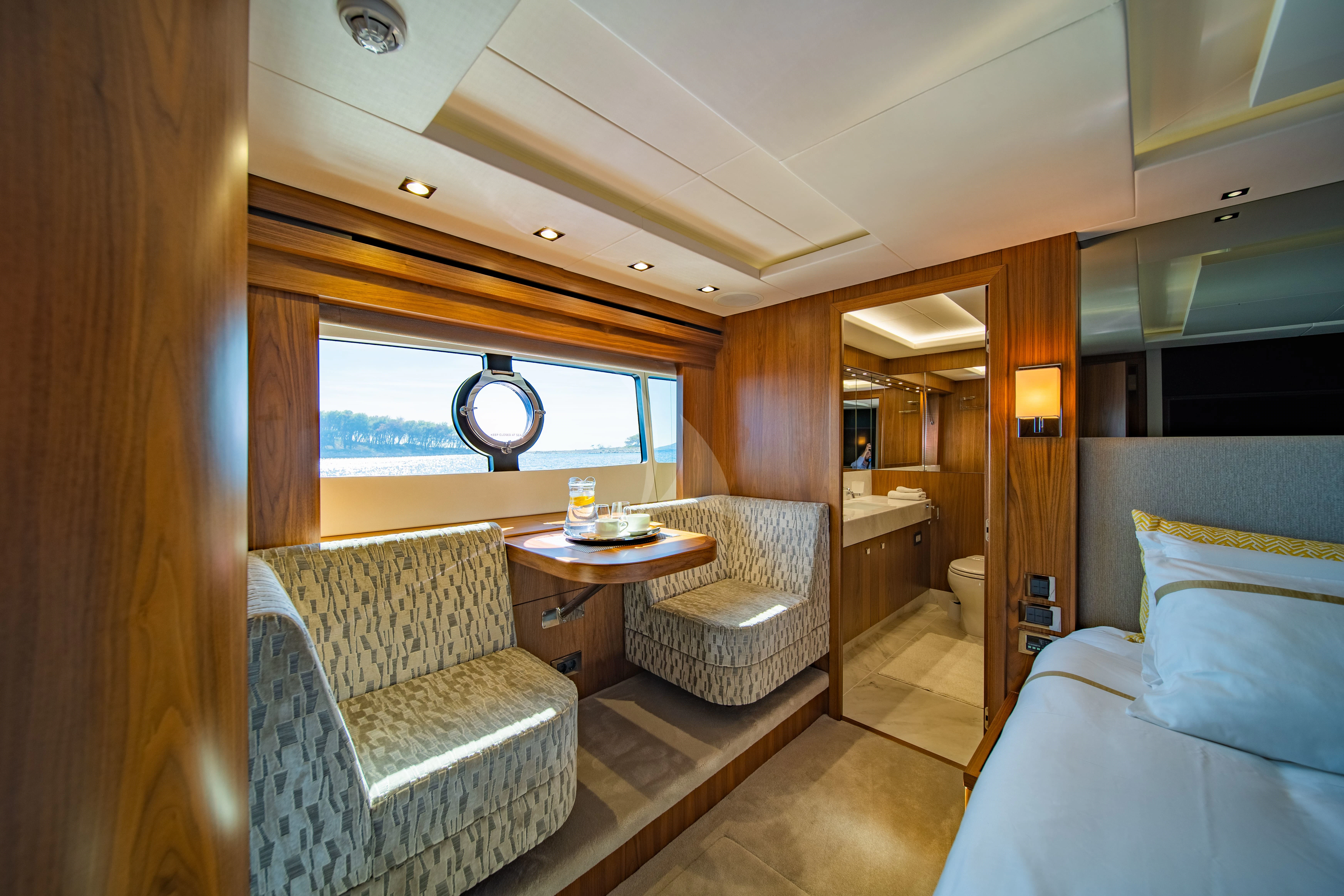 a room with a table and chairs aboard BLACK MAMBA Yacht for Charter