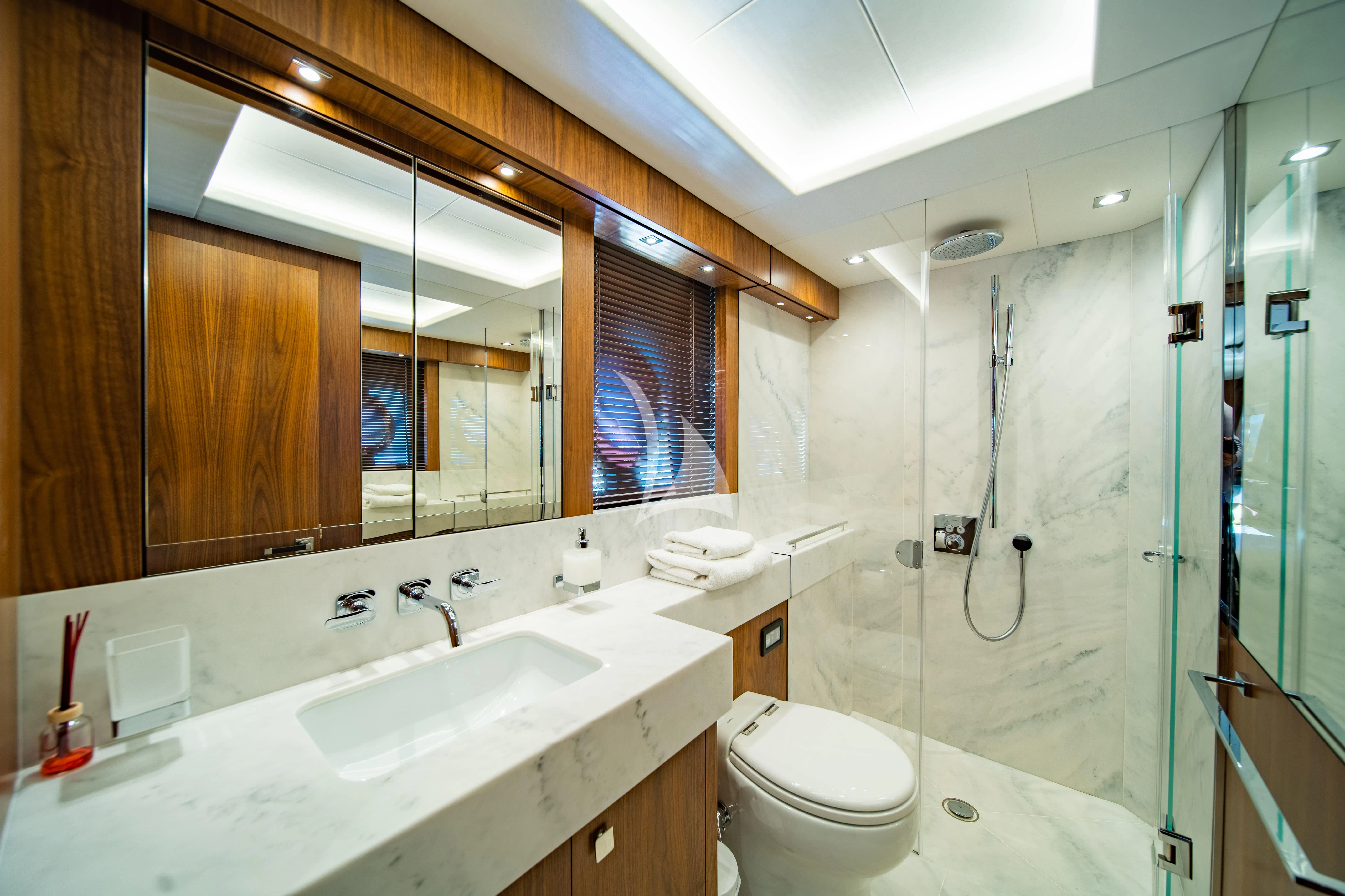 a bathroom with a glass shower aboard BLACK MAMBA Yacht for Charter
