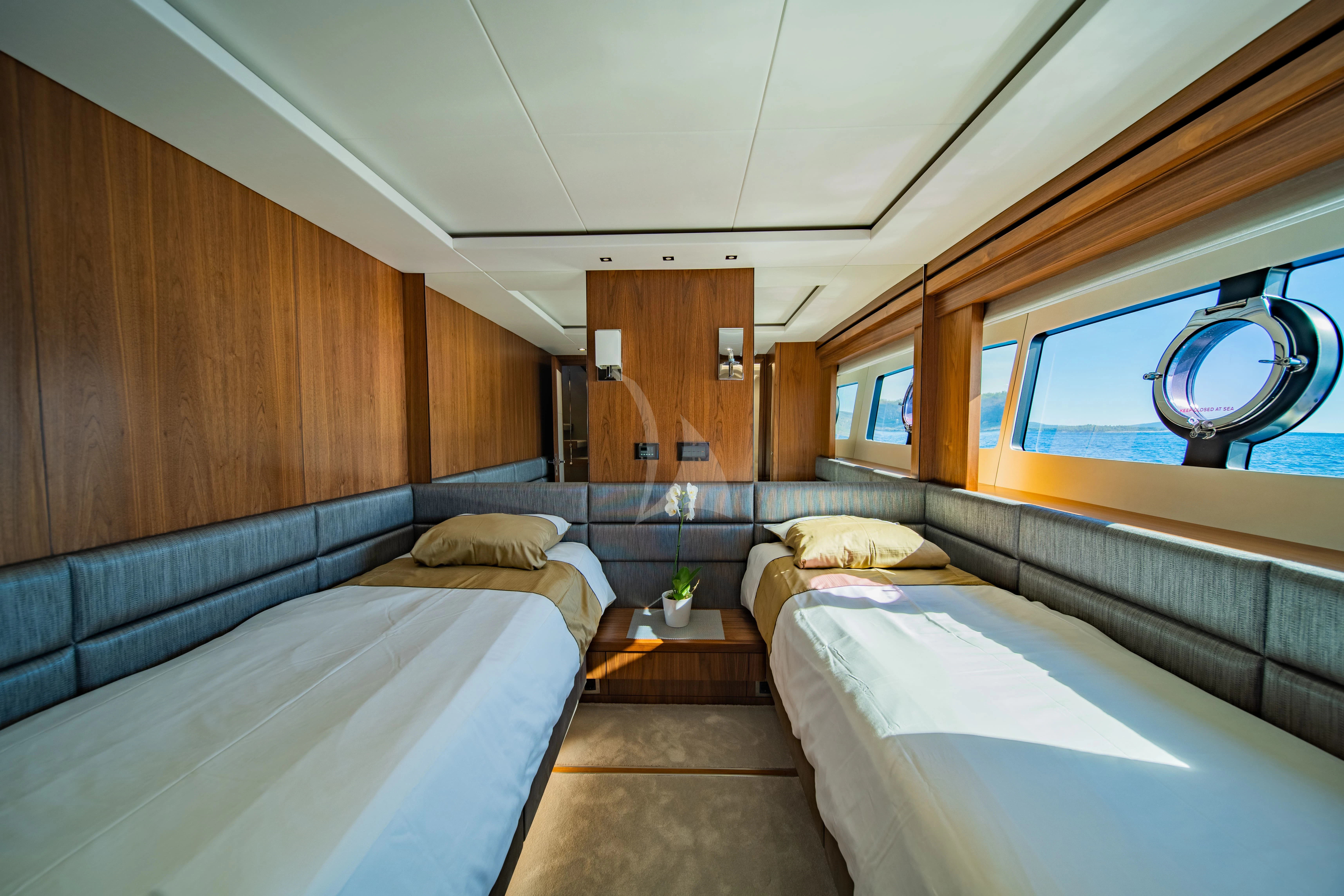 a room with two beds aboard BLACK MAMBA Yacht for Charter