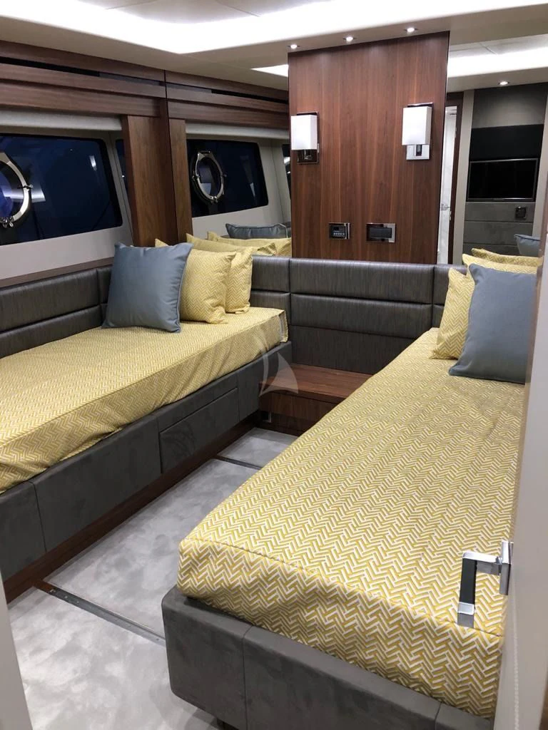 a hotel room with a bed aboard BLACK MAMBA Yacht for Charter